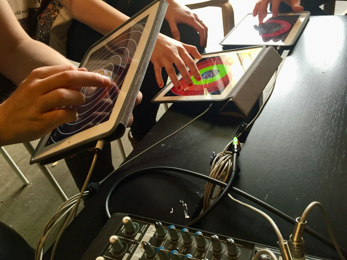 Musicians experiment with PhaseRings at a workshop
