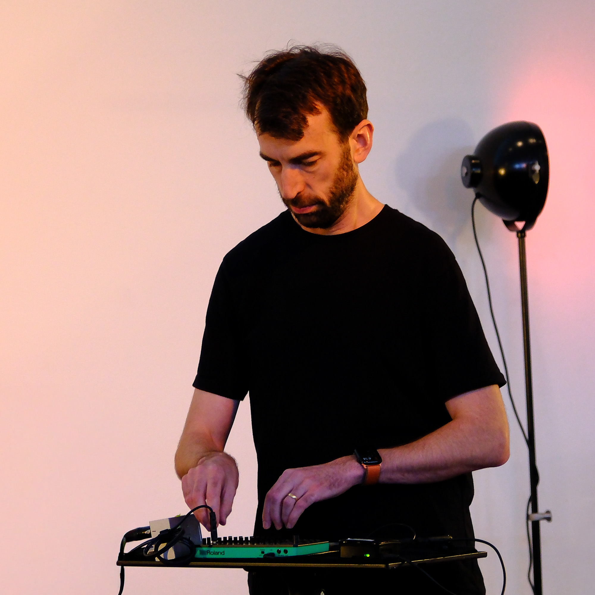 Charles Martin playing a synthesiser at the Drill Hall Gallery, Canberra.