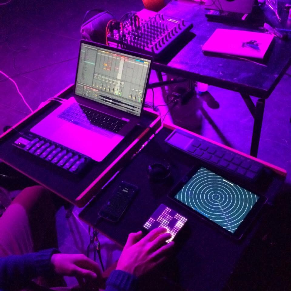 Two synthesiser and computer setups on stage at the Ainslie and Gorman Arts Centre; Charles Martin on the left plays a Roli Lightpad Block with Ableton Live on screen