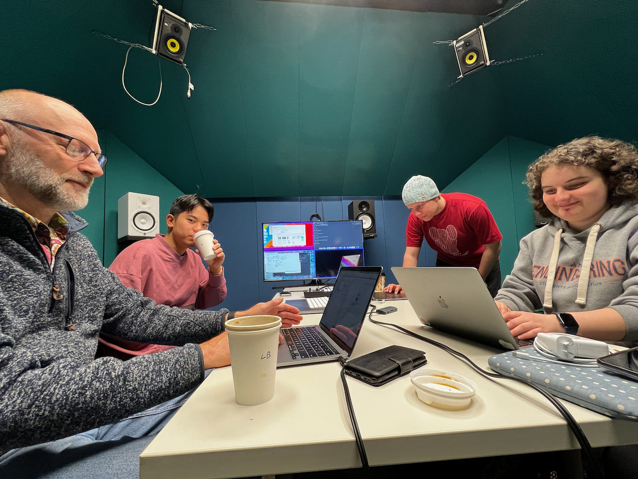 Another LENS group working together in a studio with audio equipment