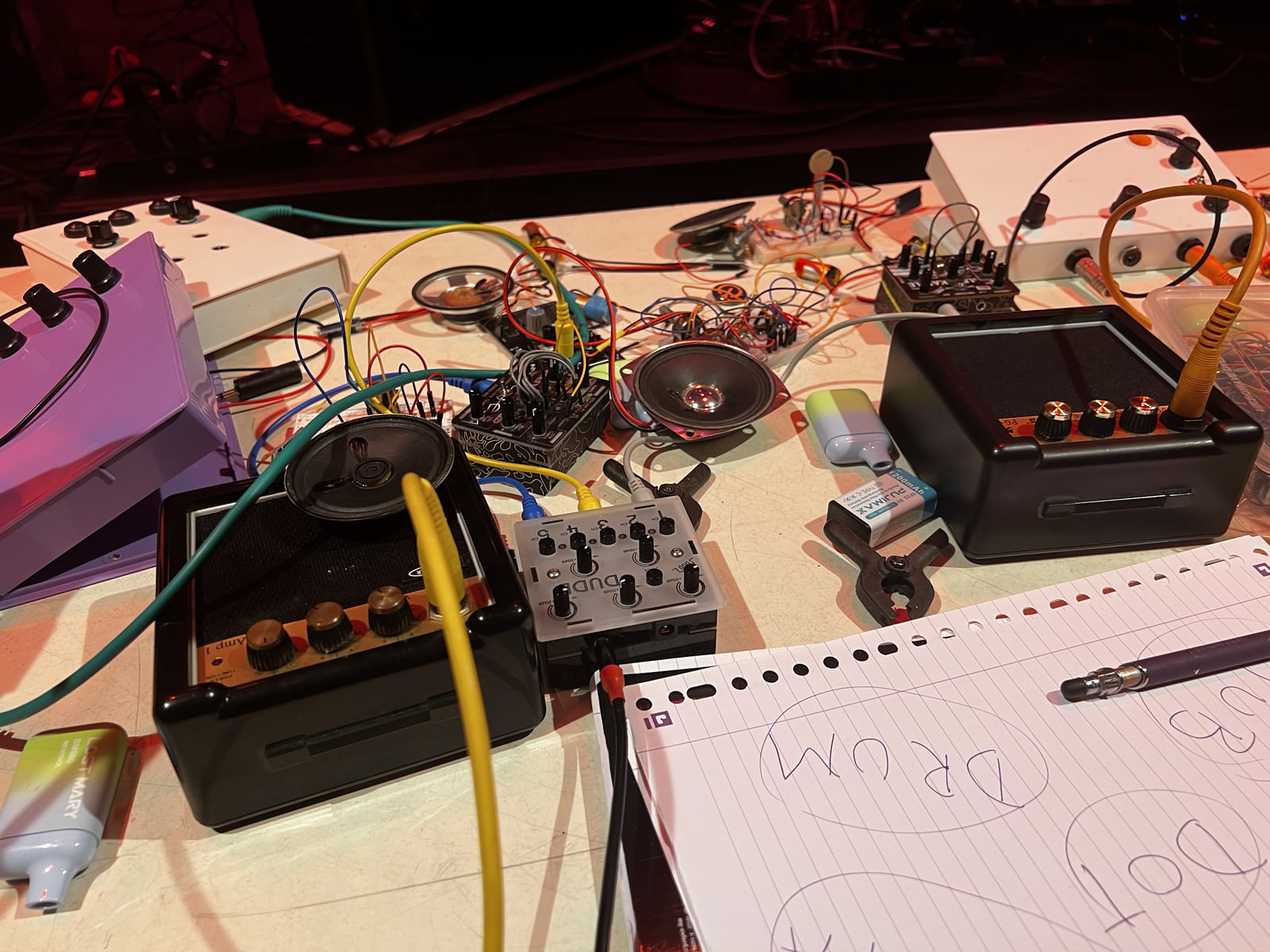 DIY synths using recovered vape batteries at the club concert.