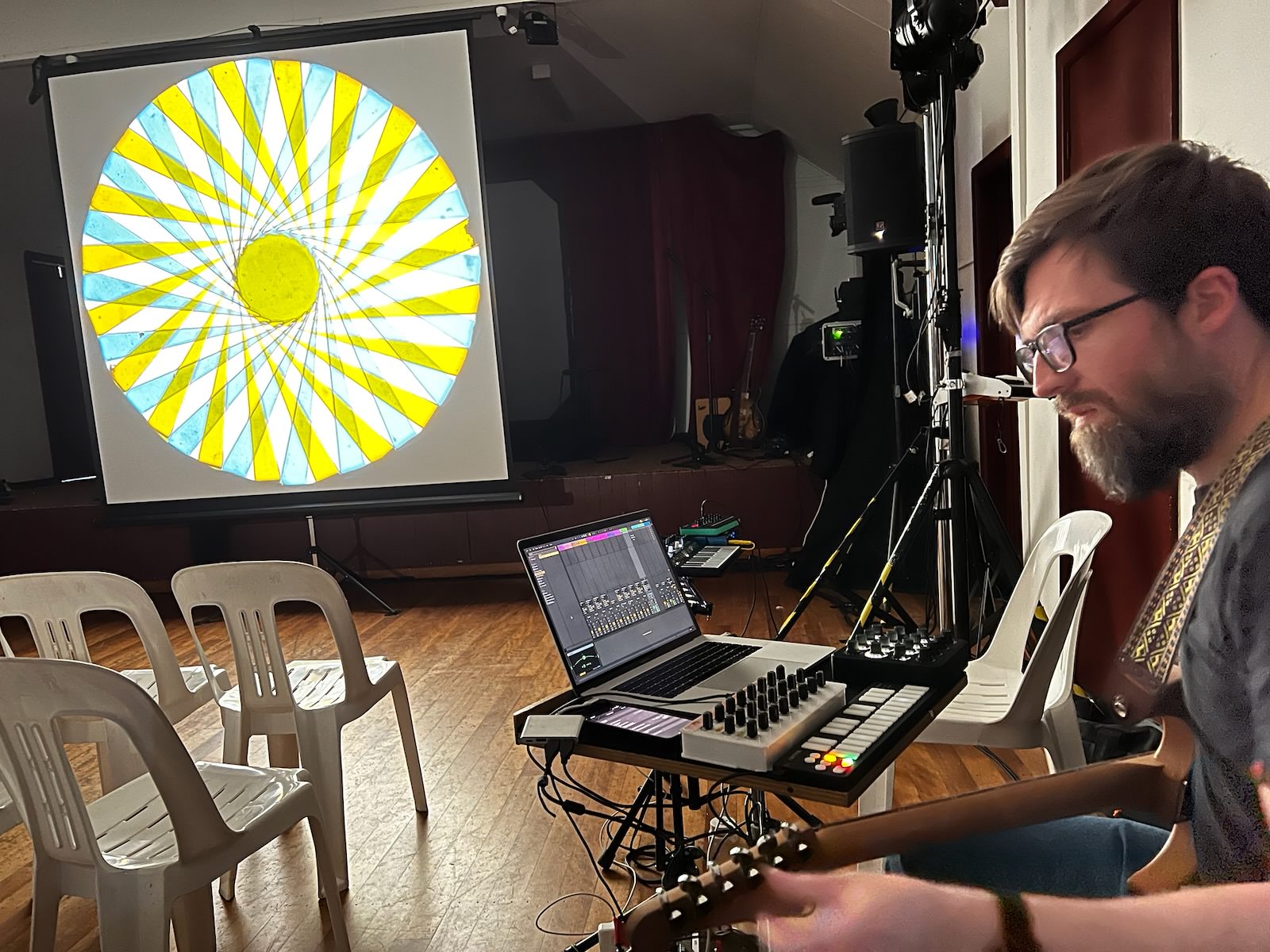 Soundcheck in Tathra Hall showing the magic lantern projection with a chromatrope slide