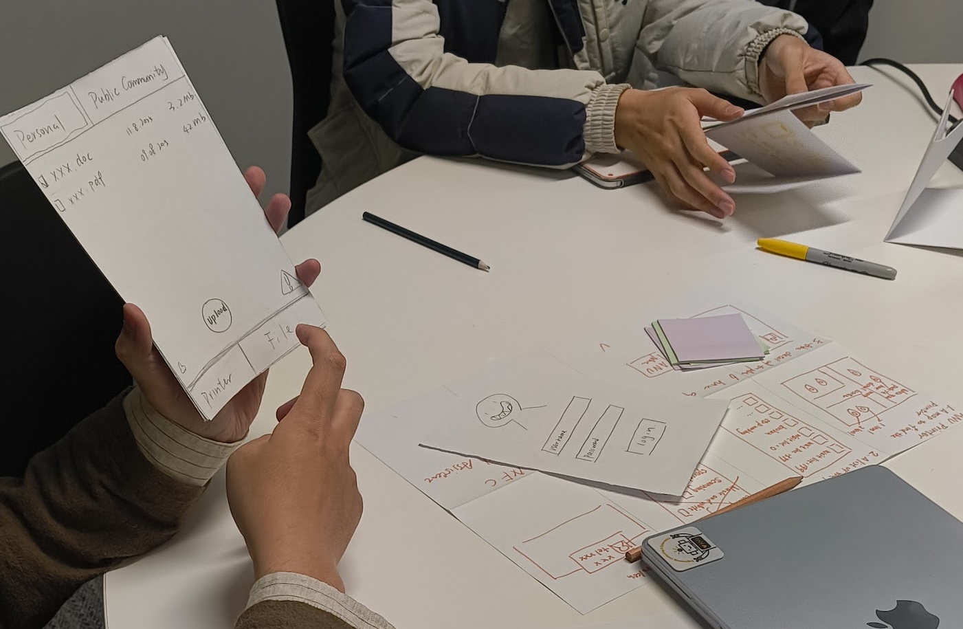 Students creating low-fi prototypes in a workshop.